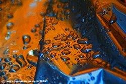 Raindrops on the woodpile cover